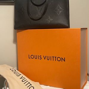 Louis Vuitton OnTheGo GM in black. Has original dust bag and box.
